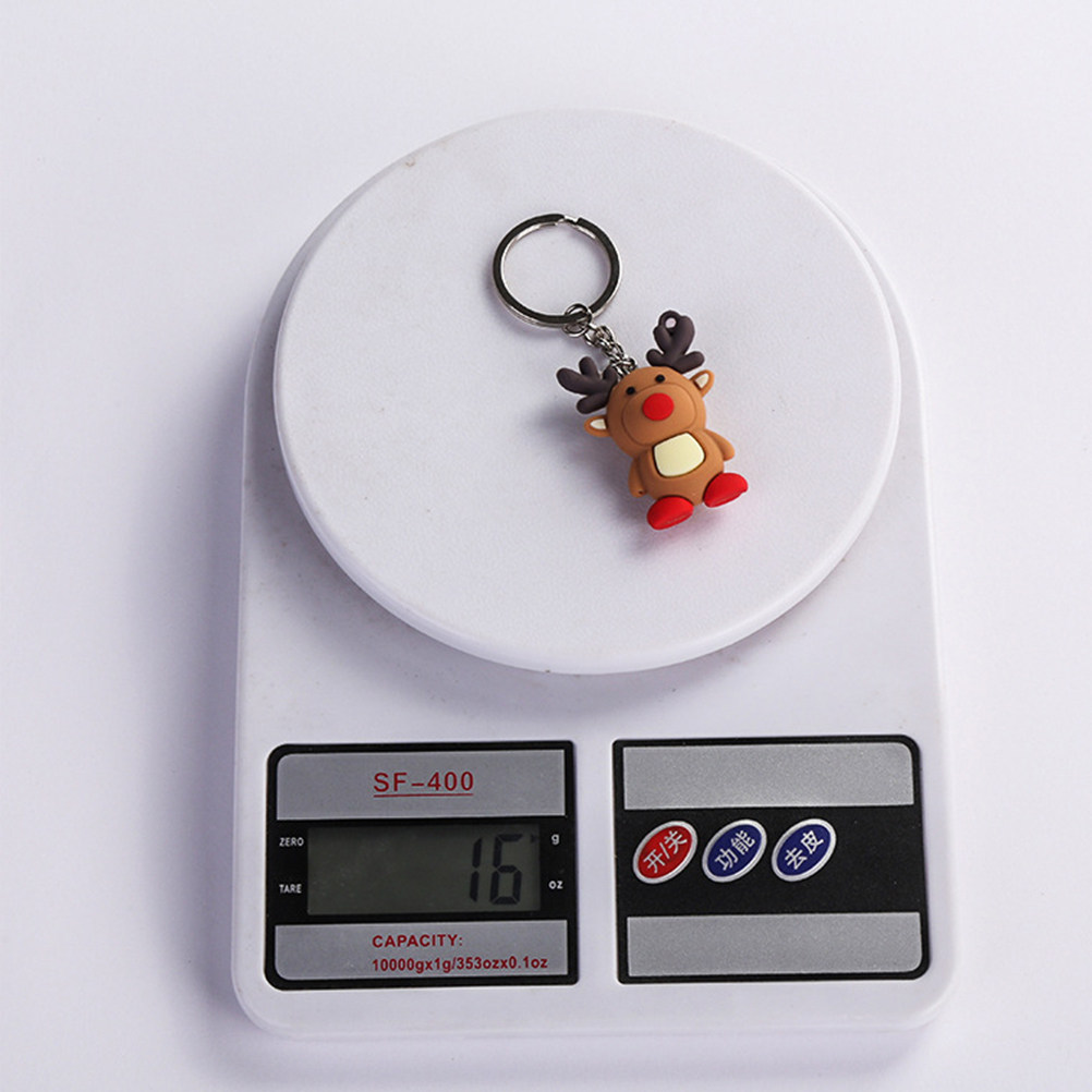 Car Accessories Xmas Gifts - 高級感あふれるクリスマス鹿のキーチェーン。ユニークな3Dデザインのトナカイ型キーリングで、バッグや車のキーを飾り、お祝いのアクセサリーとして最適。クリスマスギフトにも。